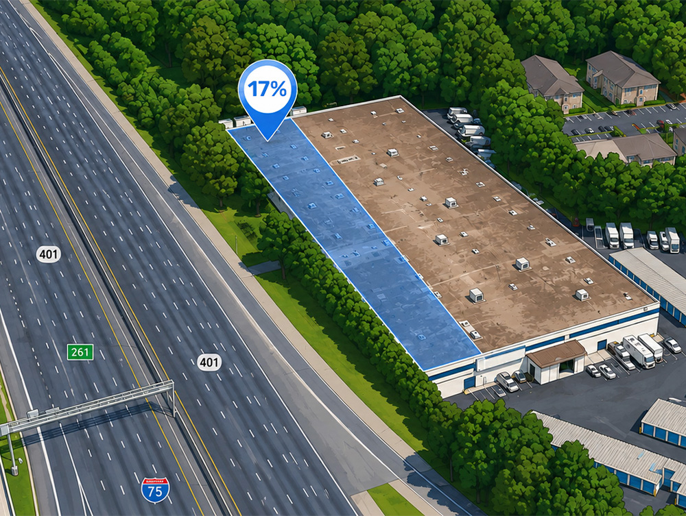 Aerial illustration of 1155 Powers Ferry Place with the ~17% facility footprint highlighted in blue along I-75, and the existing self-storage buildings and perimeter tree buffer